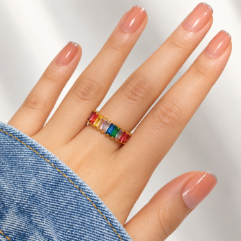 Water droplets beading across anti-tarnish waterproof rainbow baguette adjustable ring during hand-washing