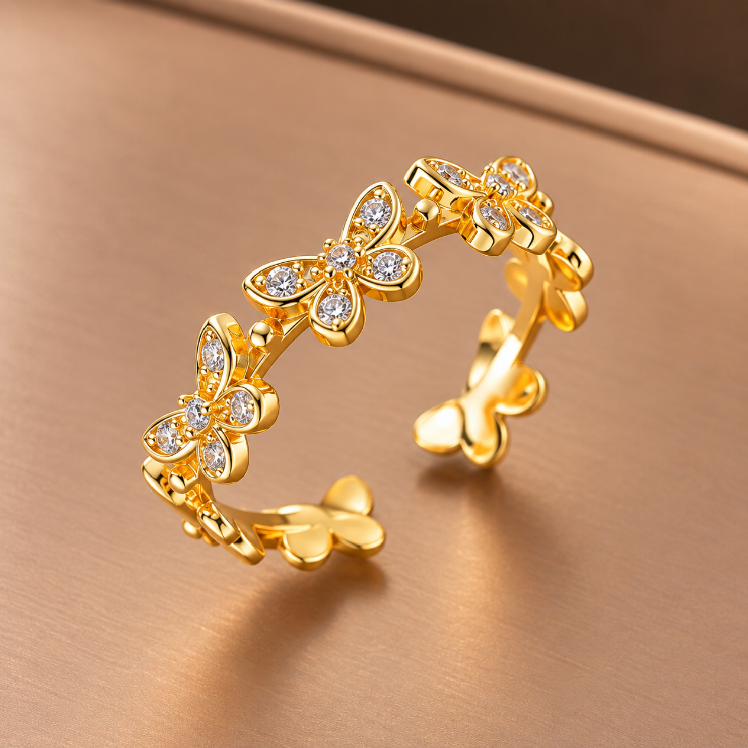 Yougorgeous 18K gold plated crystal butterfly garland adjustable ring on white background Yougorgeous 18K gold plated crystal butterfly garland adjustable ring on white background