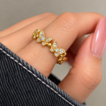 Model wearing Yougorgeous open cuff butterfly eternity ring on index finger