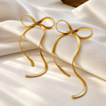 Yougorgeous 18K gold plated snake chain bow drop earrings on white background