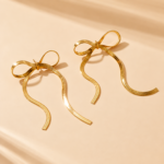 Yougorgeous 18K gold plated snake chain bow drop earrings on white background