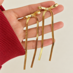 Yougorgeous 18K gold plated snake chain bow drop earrings on white background