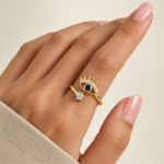 Yougorgeous 18K gold plated evil eye sunburst adjustable bypass ring on white background