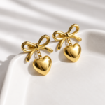 Yougorgeous 18K gold plated bow puffed heart drop earrings on white background