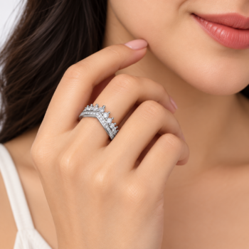 Macro detail of round brilliant crystals and micro-pave wishbone chevron contour on crystal tiara ring