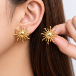 Yougorgeous 18K gold plated celestial sunburst stud earrings on white background