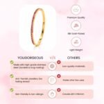 Yougorgeous 18K gold pink crystal tennis bangle with channel set stones on white background