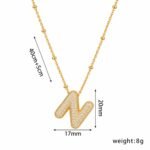 Yougorgeous 18K gold bubble letter N necklace with crystal pavé on white background