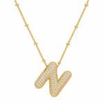 Yougorgeous 18K gold bubble letter N necklace with crystal pavé on white background