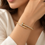 74Yougorgeous 18K gold crystal nail hinged bangle with clear pavé crystals on white background