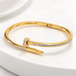 74Yougorgeous 18K gold crystal nail hinged bangle with clear pavé crystals on white background